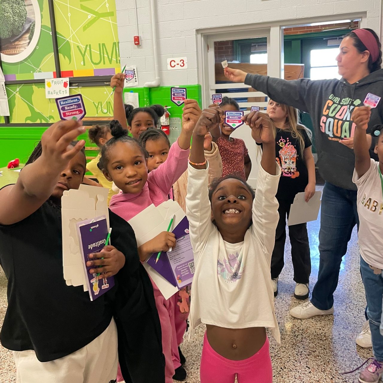 Girl Scouts show off the patch they have just earned together